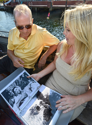 Stephen Bogart examines photographs of his father's illustrious movie career aboard the African Queen with Suzanne Holmquist, who helped refurbish the 100-year-old vessel with her husband, Captain Lance Holmquist.